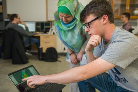 Student and faculty member conducting research